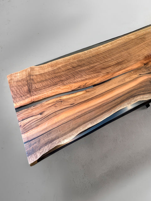 Epoxy table from walnut with smoky resin and live edge Luminoso